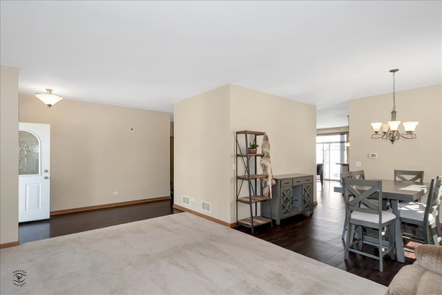 25405 Spring Street Manhattan, IL 60442 - Photo 10 of 36 a view of a livingroom with furniture and hardwood floor