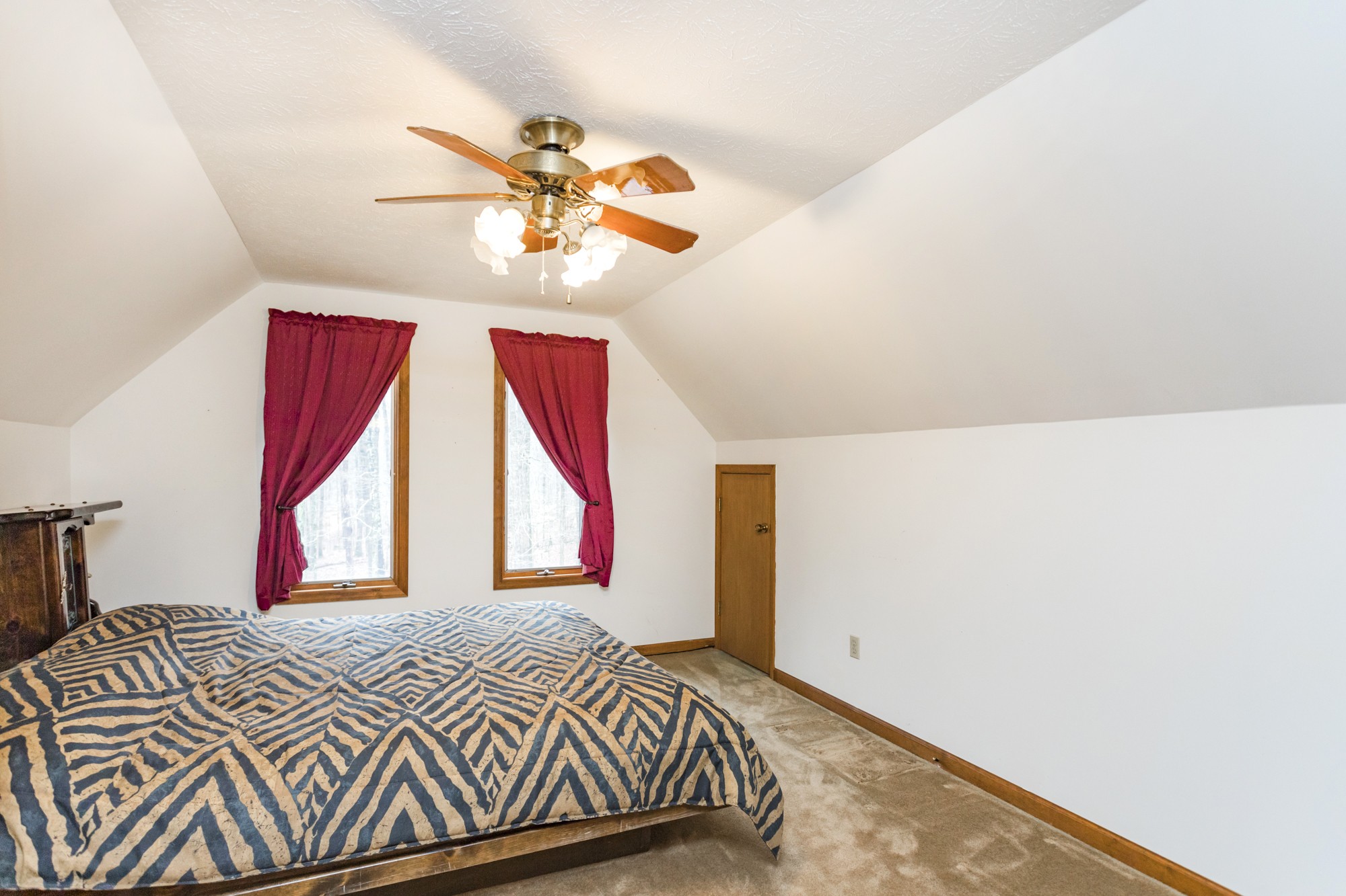 338 Black Road Dickson, TN 37055 - Photo 13 of 22 a bedroom with a bed and a chandelier