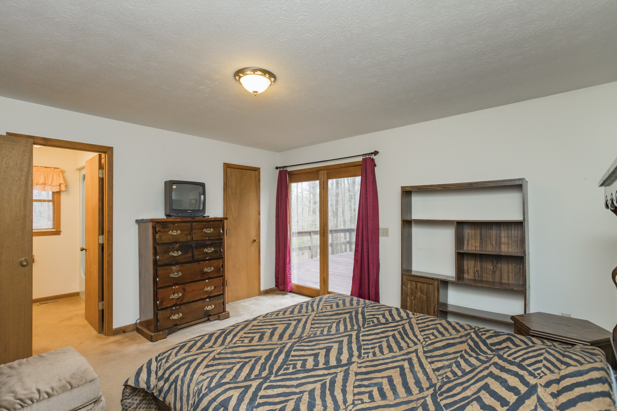 338 Black Road Dickson, TN 37055 - Photo 8 of 22 a bedroom with a bed and a closet
