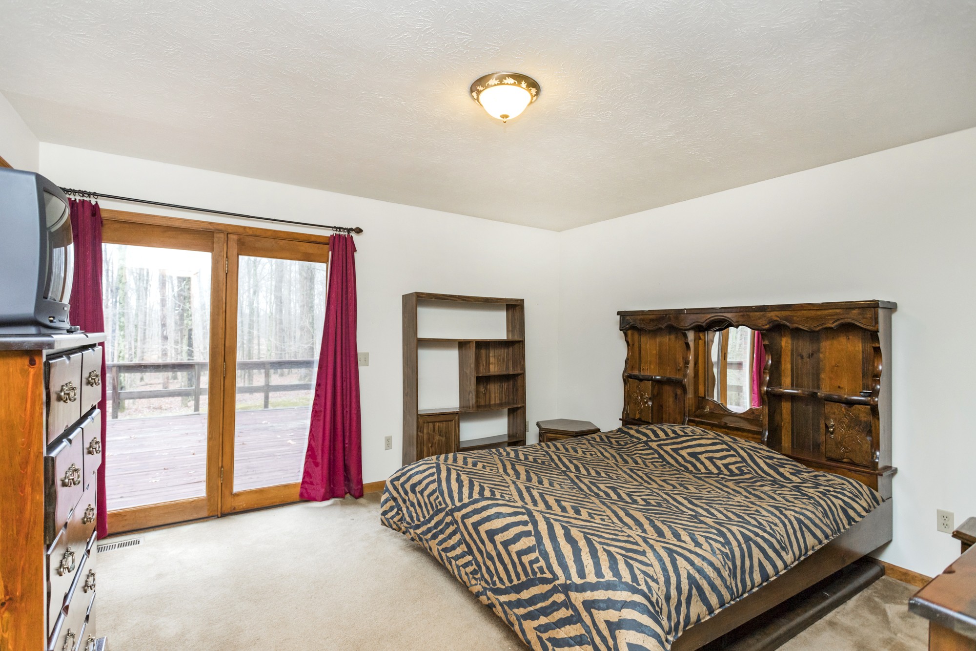 338 Black Road Dickson, TN 37055 - Photo 9 of 22 a bedroom with a large bed and a large window