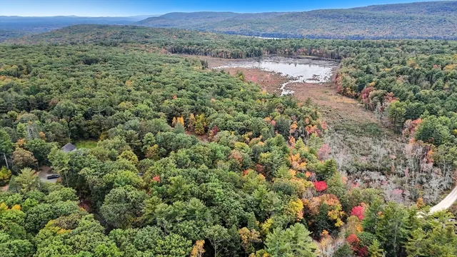 a view of a house with a flower garden