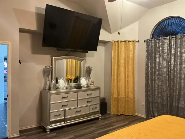a view of room with window and flat screen tv