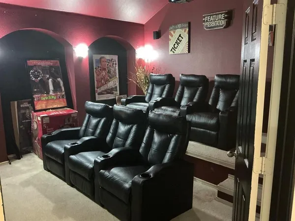 a bathroom with a sink vanity mirror and toilet