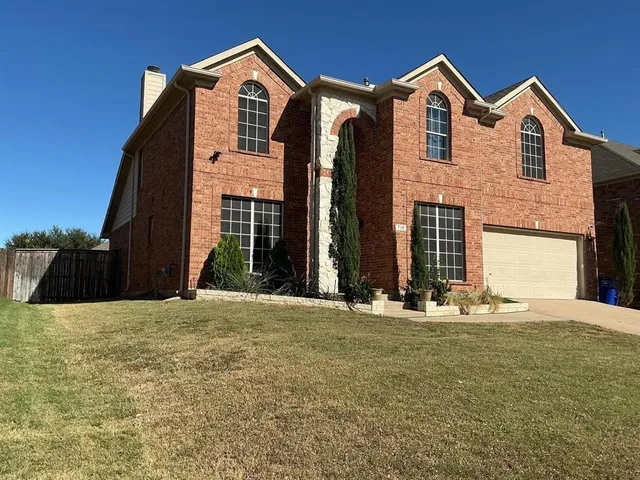 a bedroom with a bed and cabinets