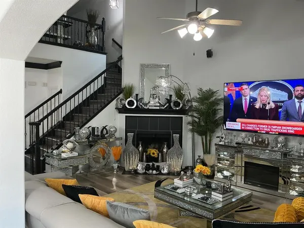 a living room with furniture and a fireplace