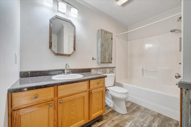 a house that has a tree in front of it