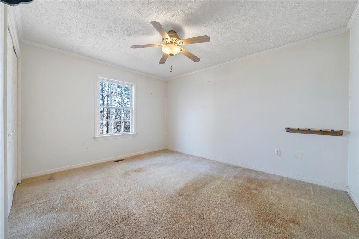 365 Isolane Road Callaway, VA 24067 - Photo 23 of 104 an empty room with window and ceiling fan