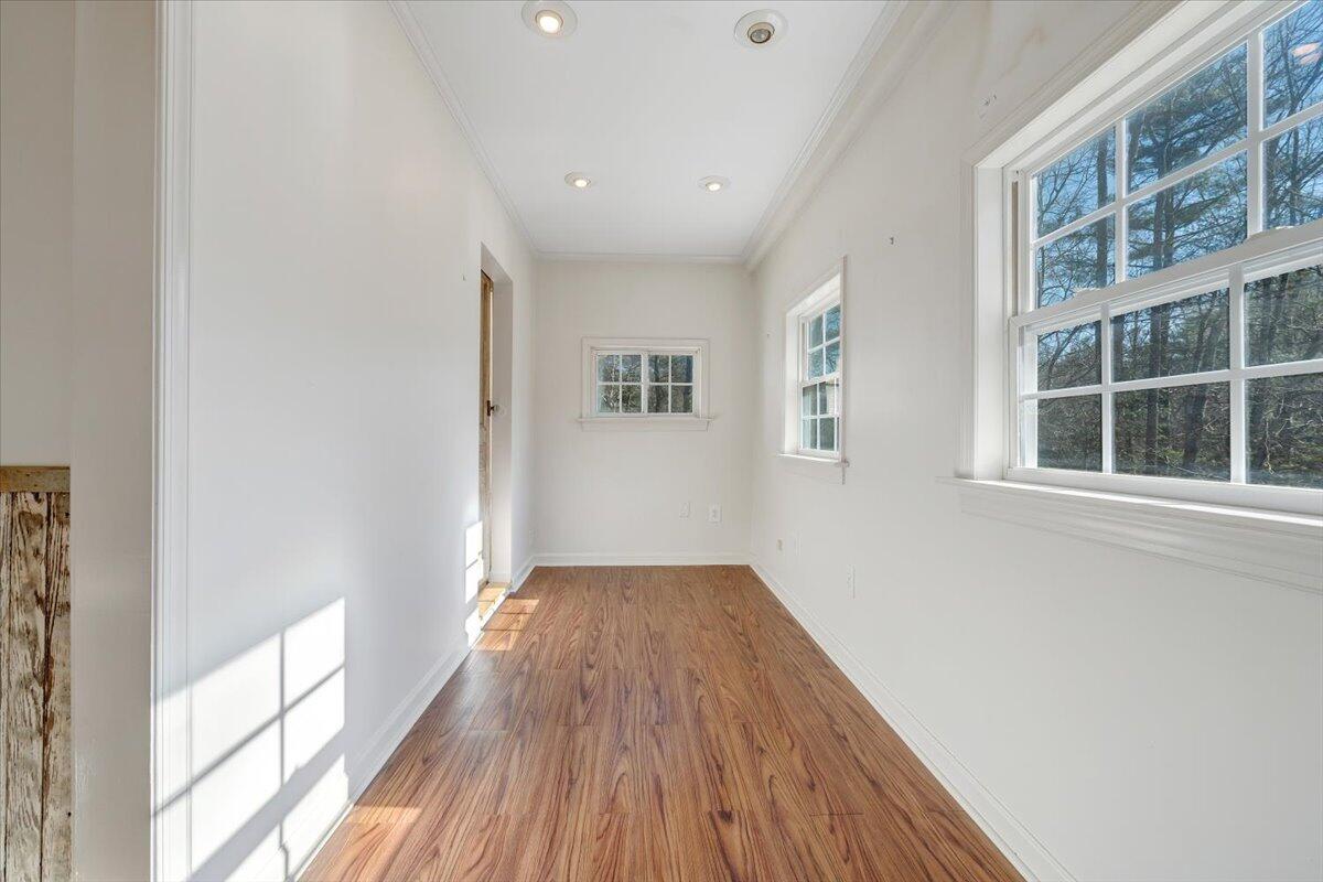 365 Isolane Road Callaway, VA 24067 - Photo 26 of 104 a view of a big room with wooden floor and windows