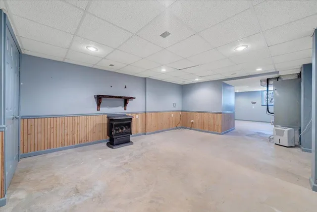 a view of house with yard and sitting area