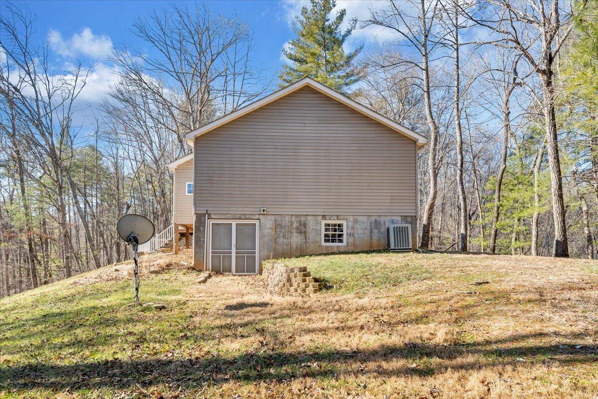 365 Isolane Road Callaway, VA 24067 - Photo 36 of 104 a house that has a tree in front of it