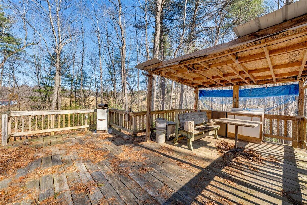 365 Isolane Road Callaway, VA 24067 - Photo 43 of 104 a view of a patio with table and chairs and wooden floor