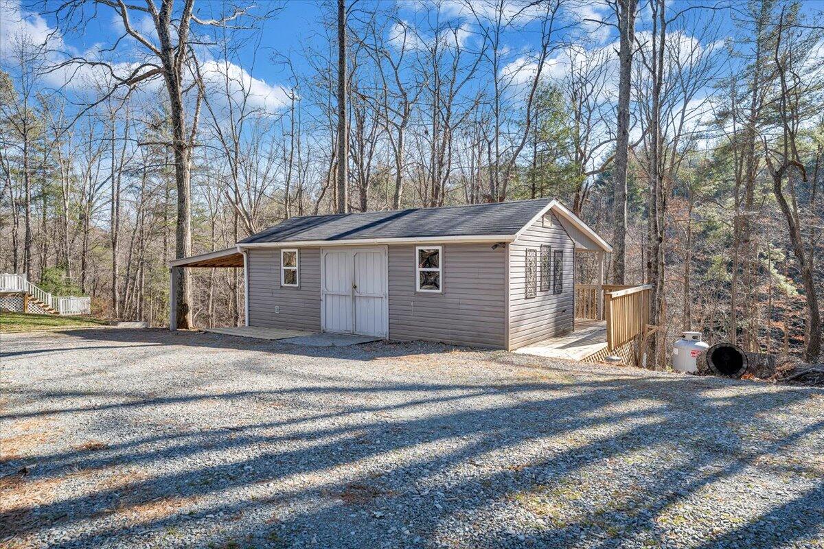 365 Isolane Road Callaway, VA 24067 - Photo 84 of 104 a front view of a house with a yard and garage