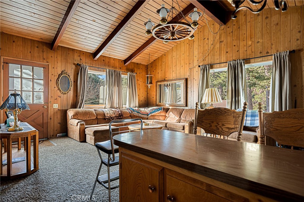 1164 Bear Springs Road Rimforest, CA 92378 - Photo 12 of 18 a outdoor dining space with furniture and wooden floor