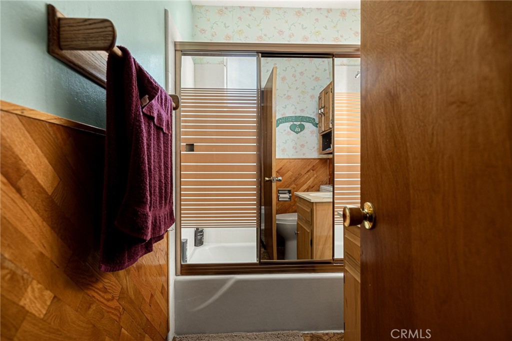 1164 Bear Springs Road Rimforest, CA 92378 - Photo 13 of 18 a bathroom with a shower and a window