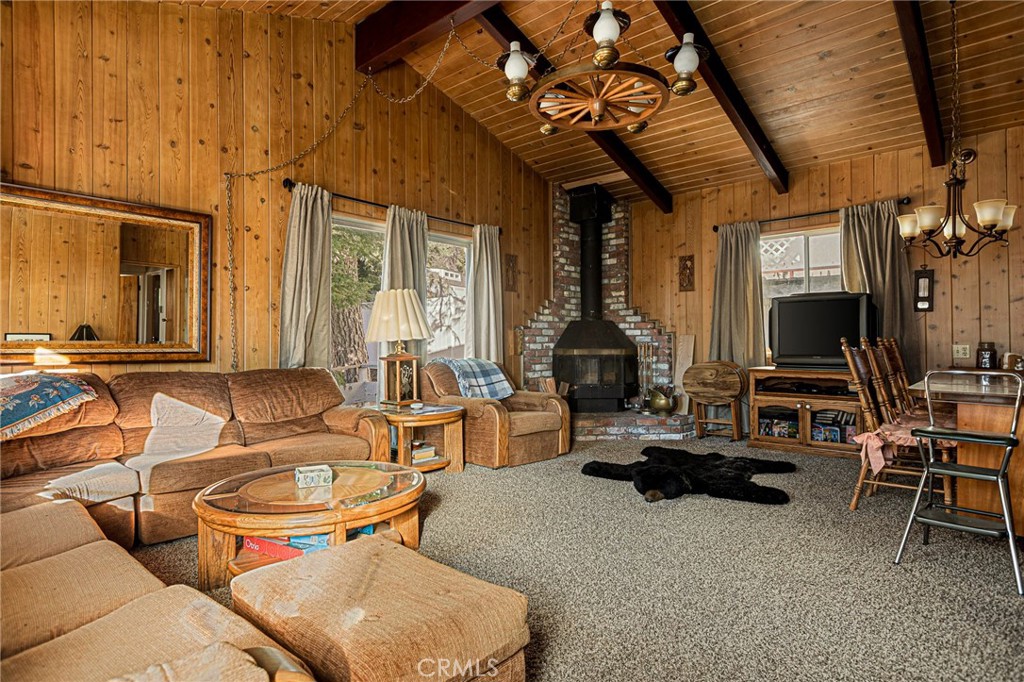 1164 Bear Springs Road Rimforest, CA 92378 - Photo 4 of 18 a living room with furniture a flat screen tv and large window