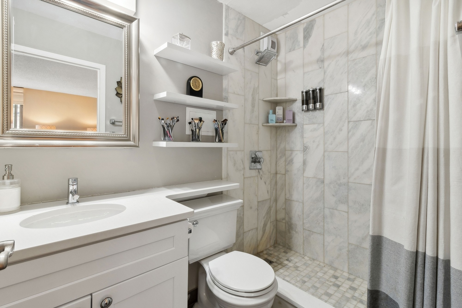 71 East Division Street, Unit 401 Chicago, IL 60611 - Photo 14 of 21 a bathroom with a sink a toilet and shower