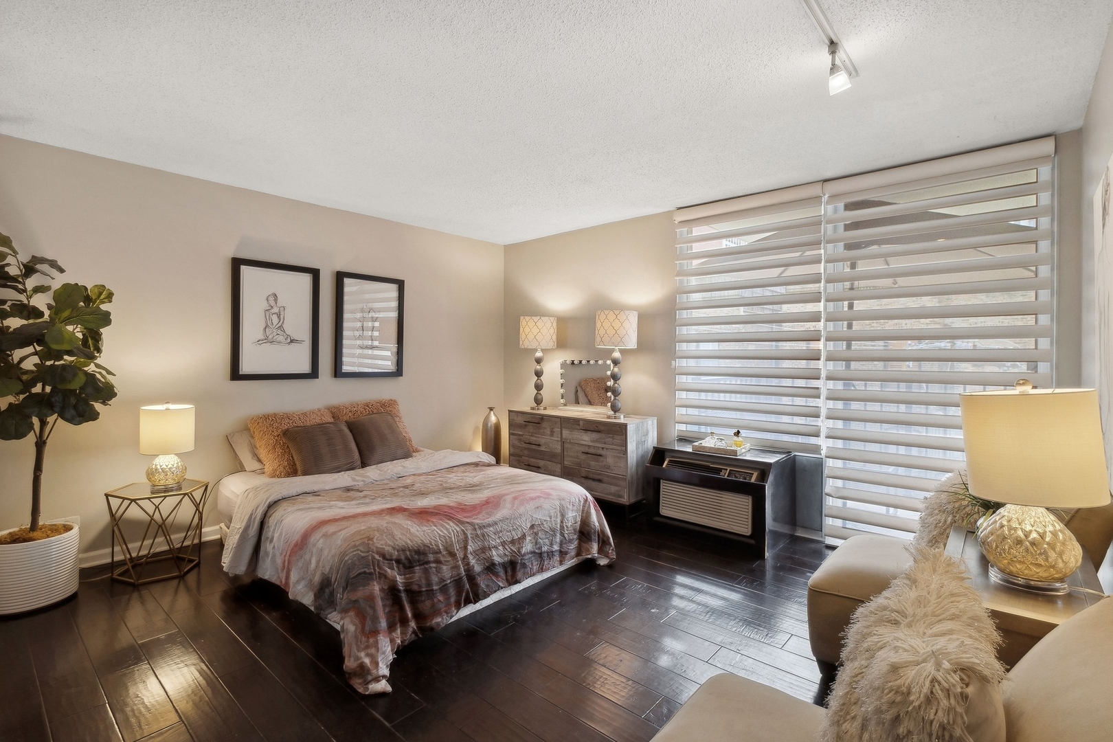 71 East Division Street, Unit 401 Chicago, IL 60611 - Photo 15 of 21 a bedroom with a bed and wooden floor