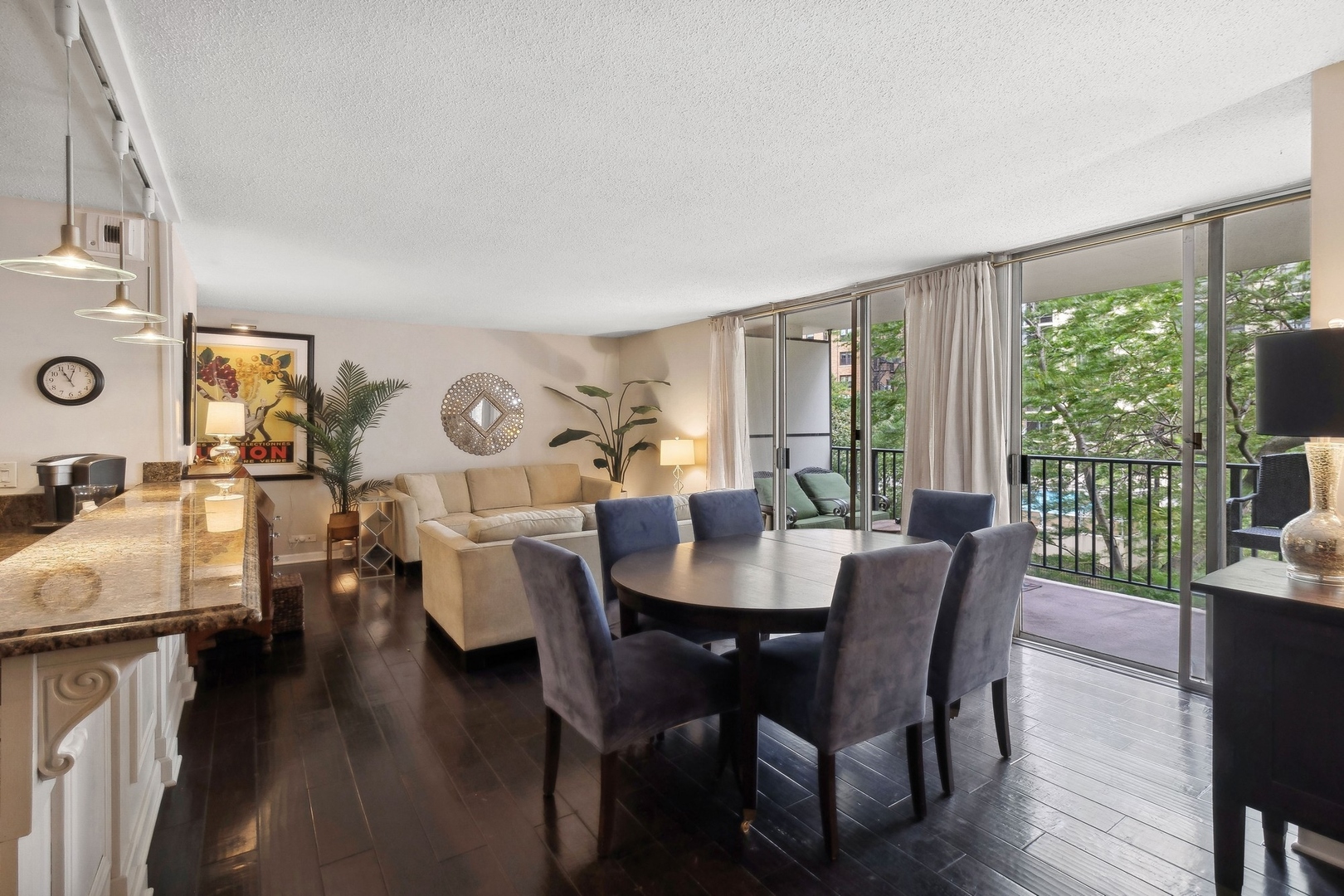 71 East Division Street, Unit 401 Chicago, IL 60611 - Photo 4 of 21 a view of a dining room with furniture and wooden floor
