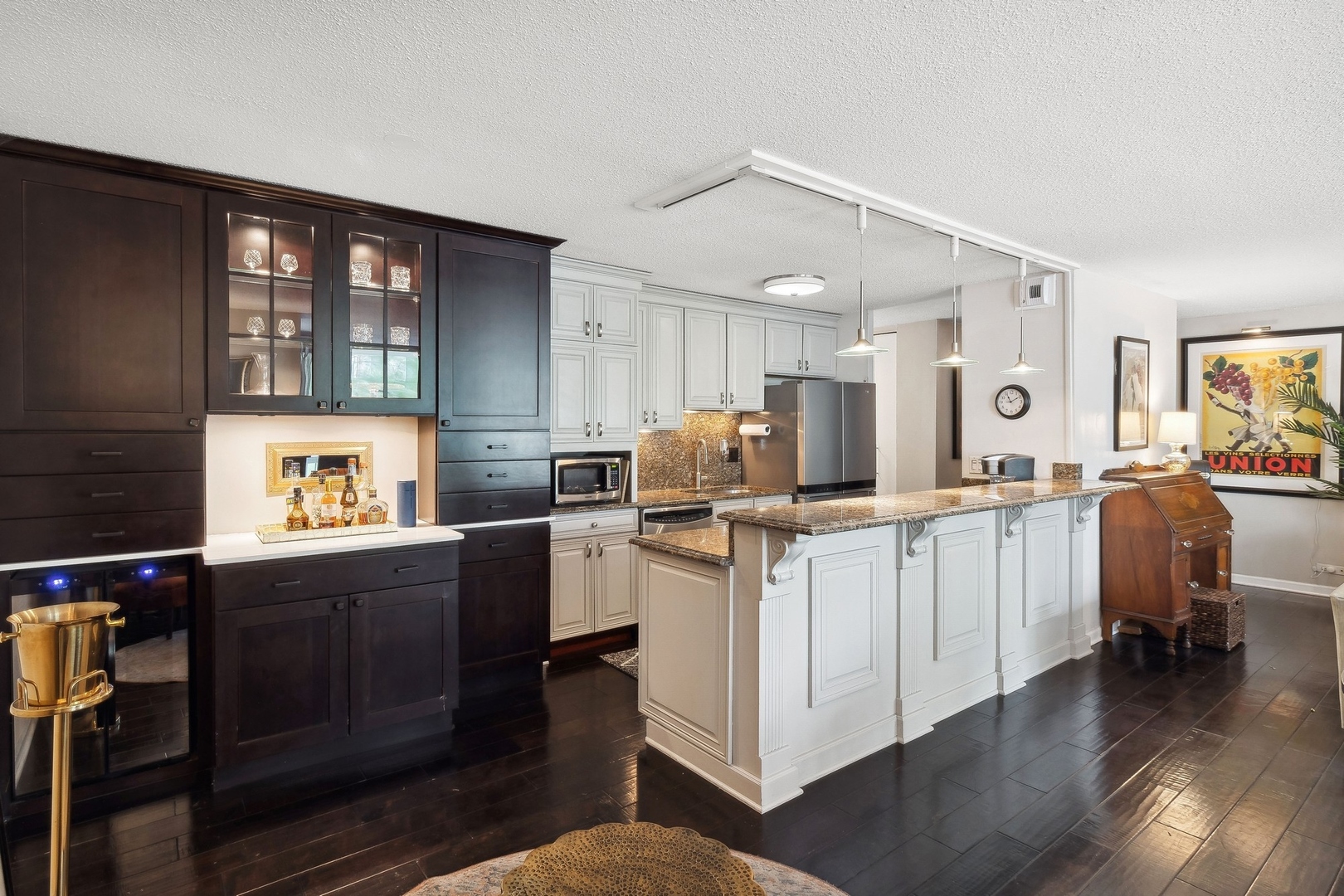 71 East Division Street, Unit 401 Chicago, IL 60611 - Photo 7 of 21 a kitchen with sink cabinets and wooden floor