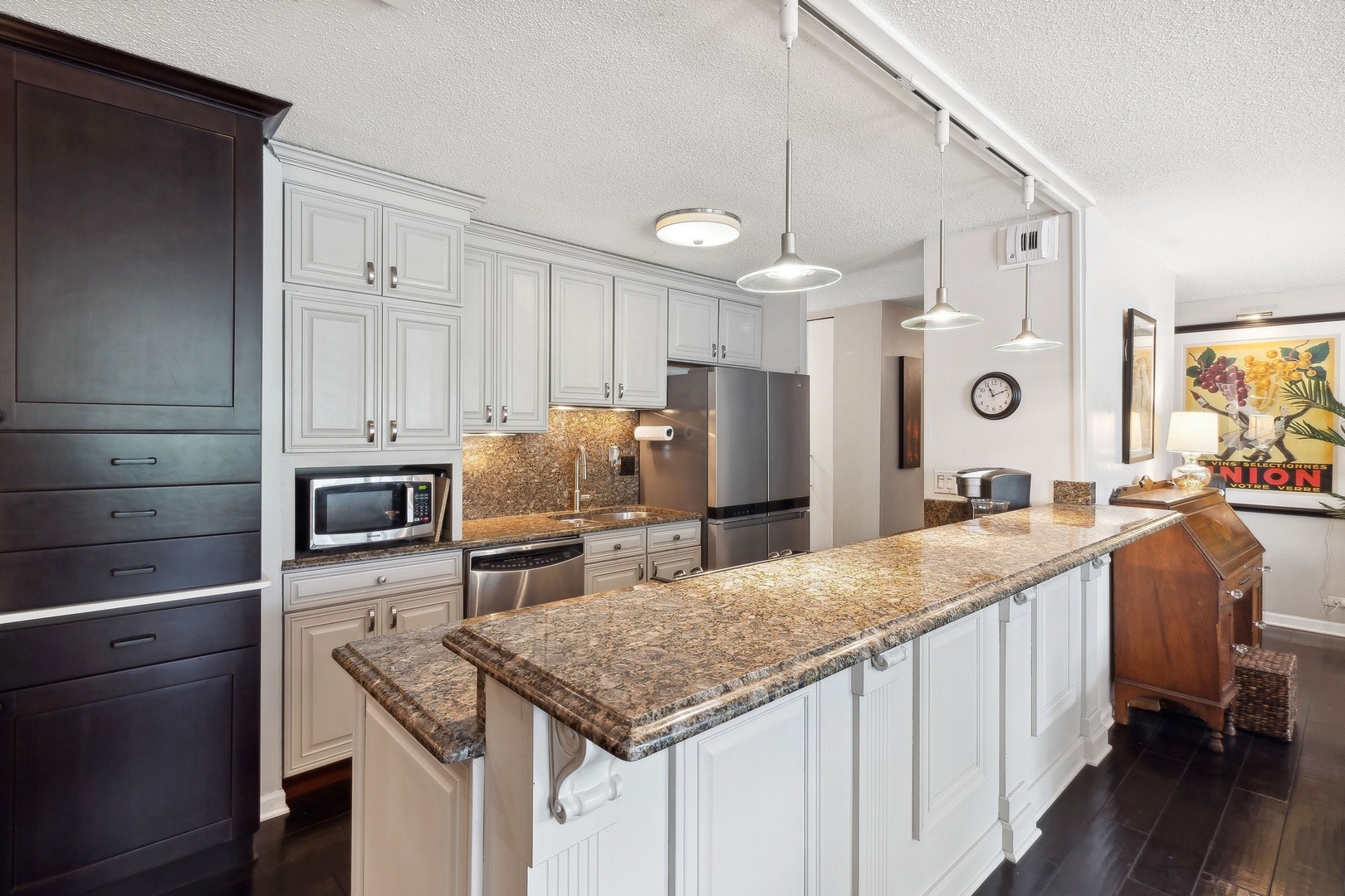 71 East Division Street, Unit 401 Chicago, IL 60611 - Photo 8 of 21 a kitchen with stainless steel appliances granite countertop a sink stove and refrigerator
