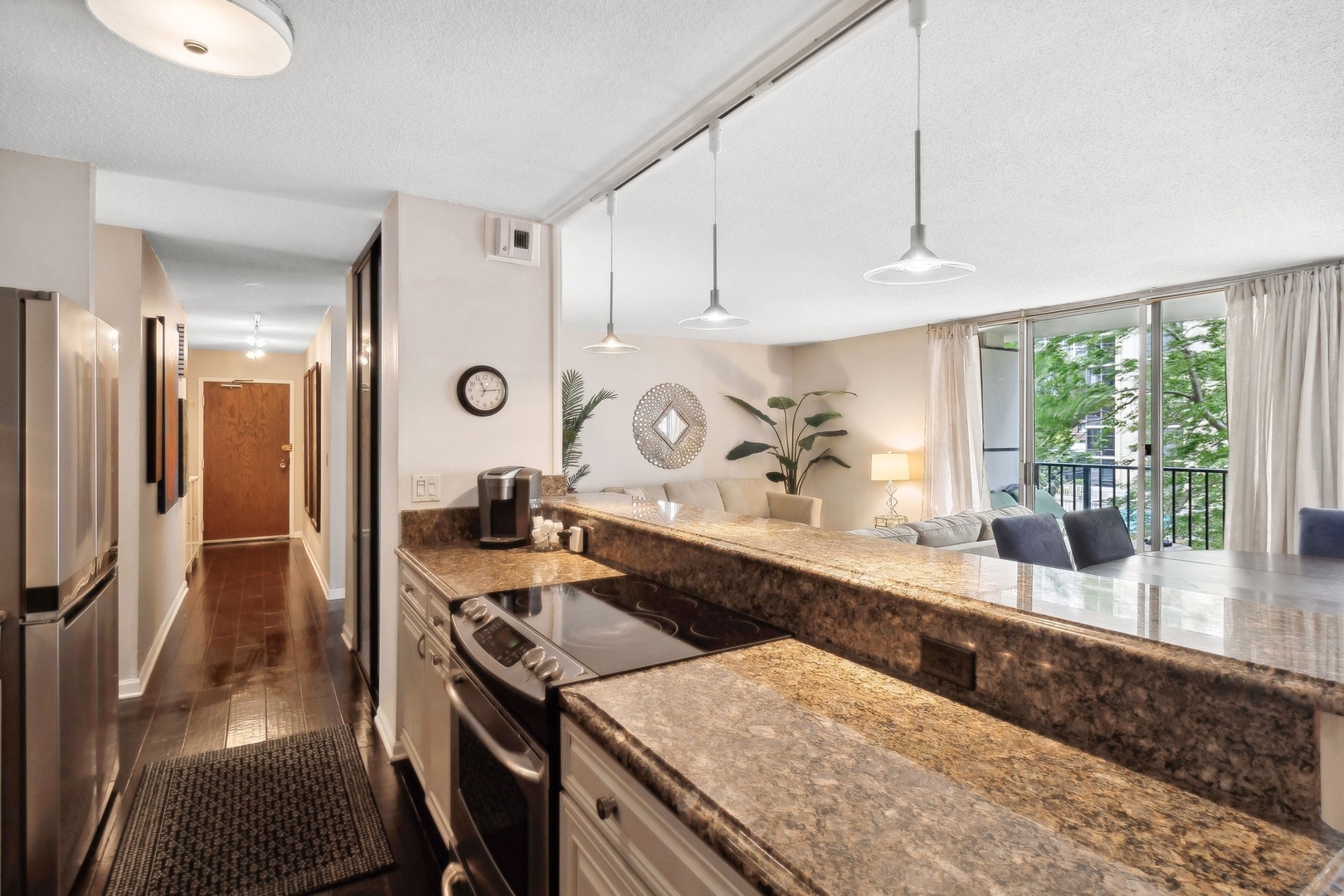 71 East Division Street, Unit 401 Chicago, IL 60611 - Photo 10 of 21 a kitchen with a sink a stove and cabinets