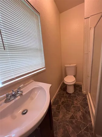 a bathroom with a sink and a toilet