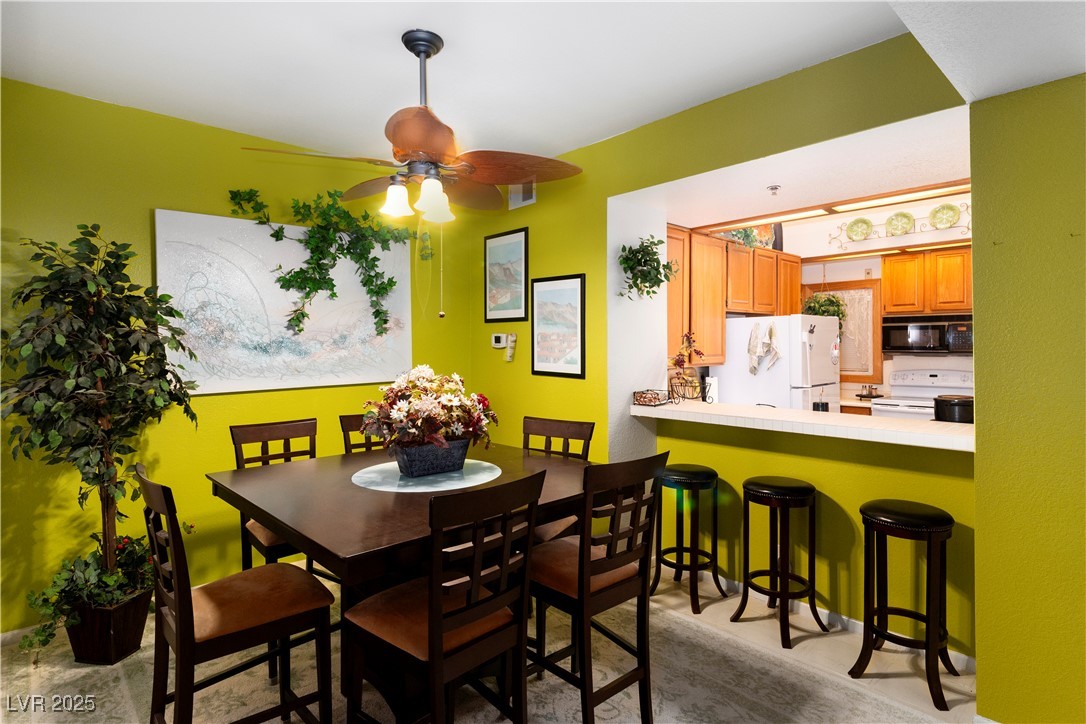 3859 Desert Marina Drive, Unit 257 Laughlin, NV 89029 - Photo 13 of 89 Dining space featuring a ceiling fan