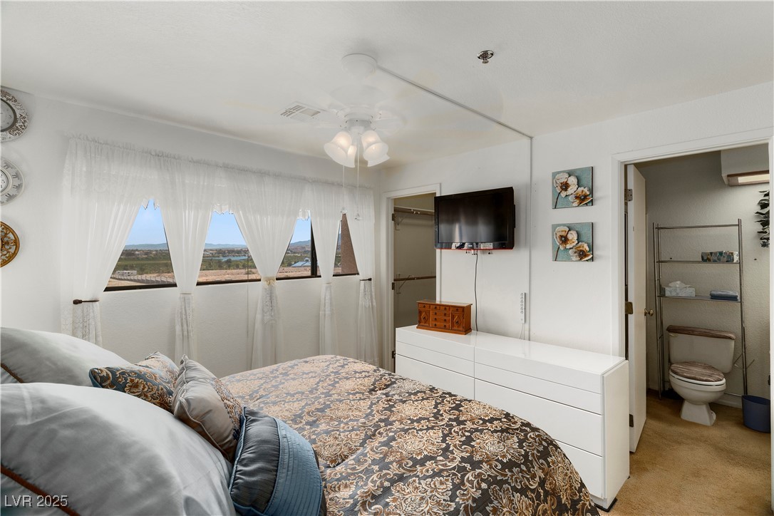 3859 Desert Marina Drive, Unit 257 Laughlin, NV 89029 - Photo 52 of 89 Carpeted Second bedroom with a ceiling fan, a walk