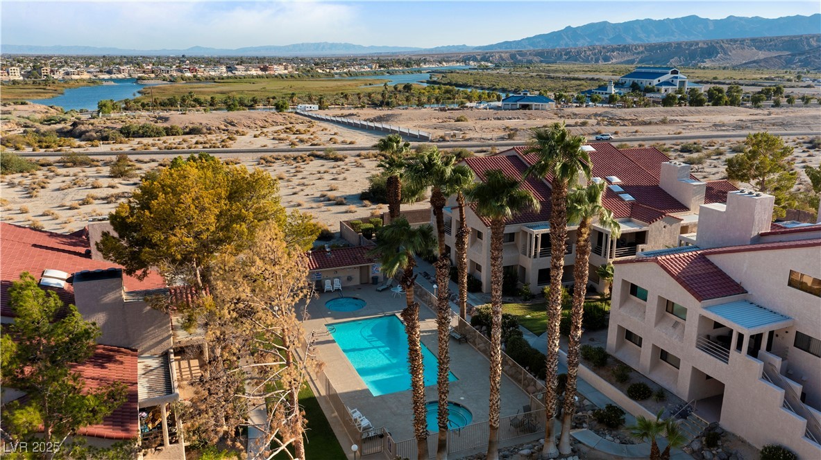 3859 Desert Marina Drive, Unit 257 Laughlin, NV 89029 - Photo 75 of 89 Aerial view of a mountain backdrop and a pool area
