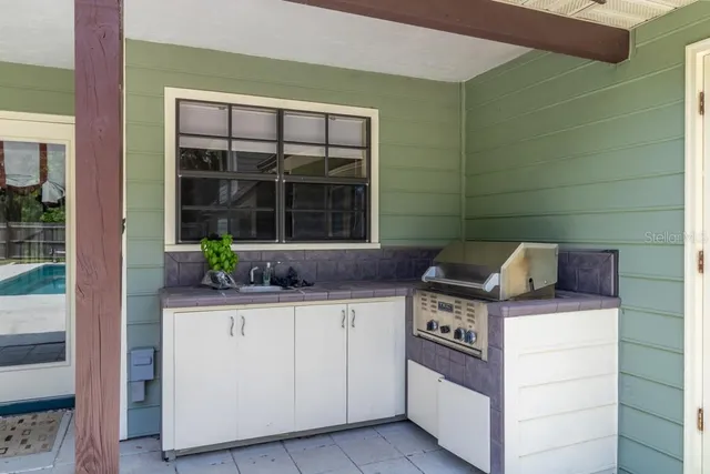 a view of a livingroom with a ceiling fan and window