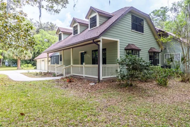 a view of a yard with a tree
