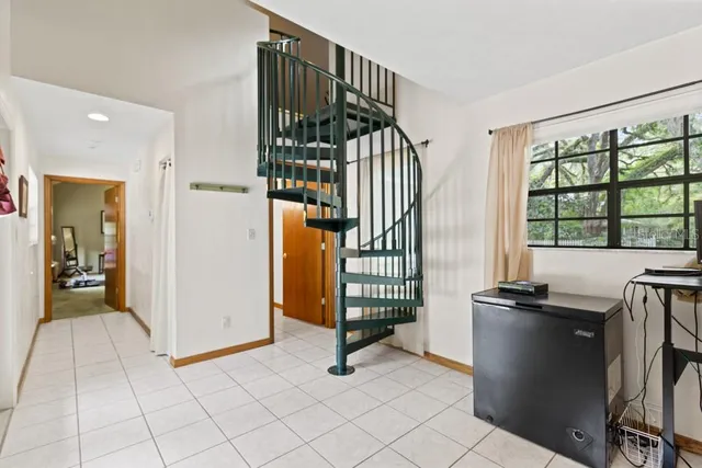 a bathroom with a sink mirror and toilet