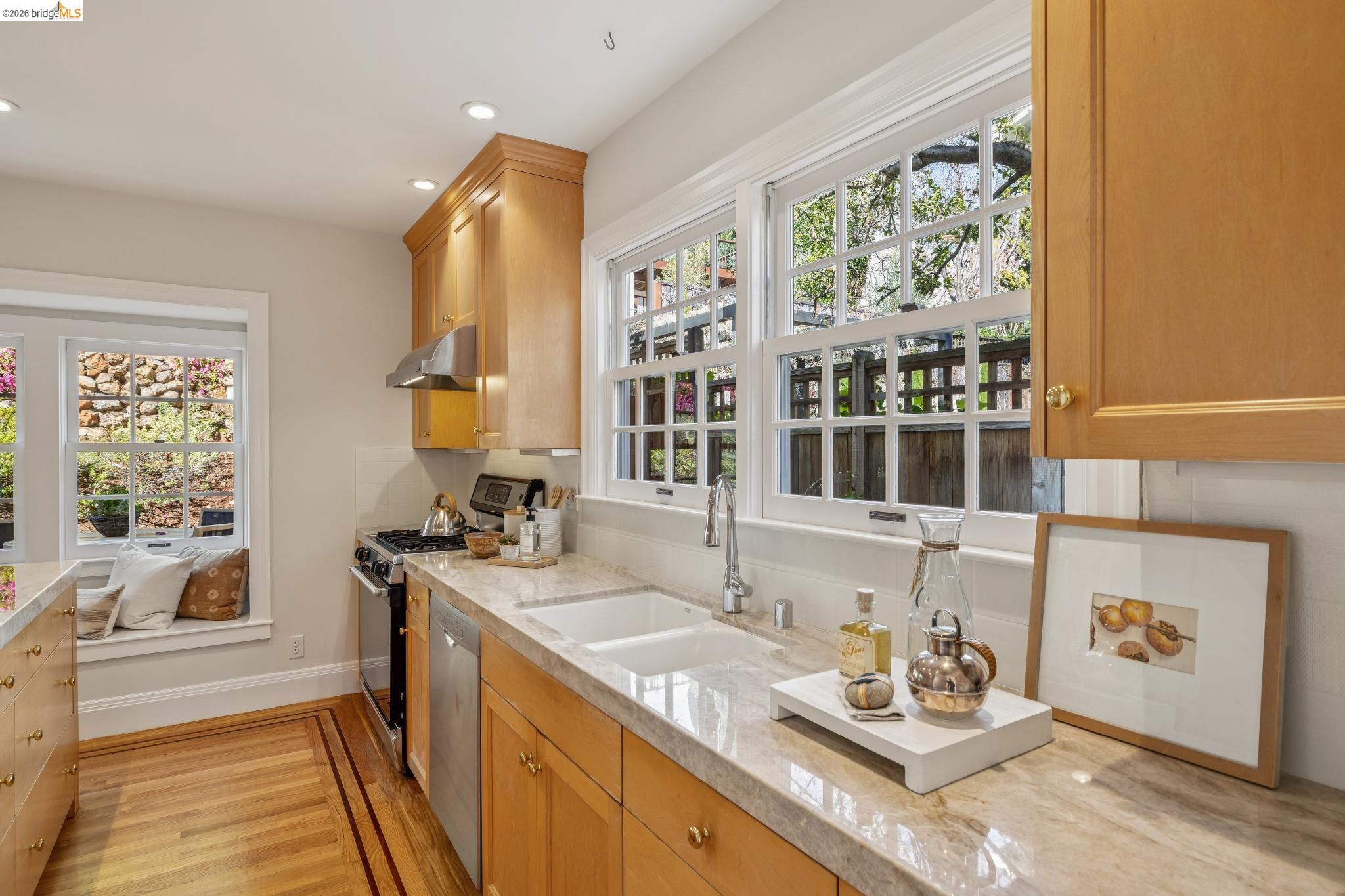 900 Rosemount Road Oakland, CA 94610 - Photo 28 of 59 a kitchen with sink refrigerator and window