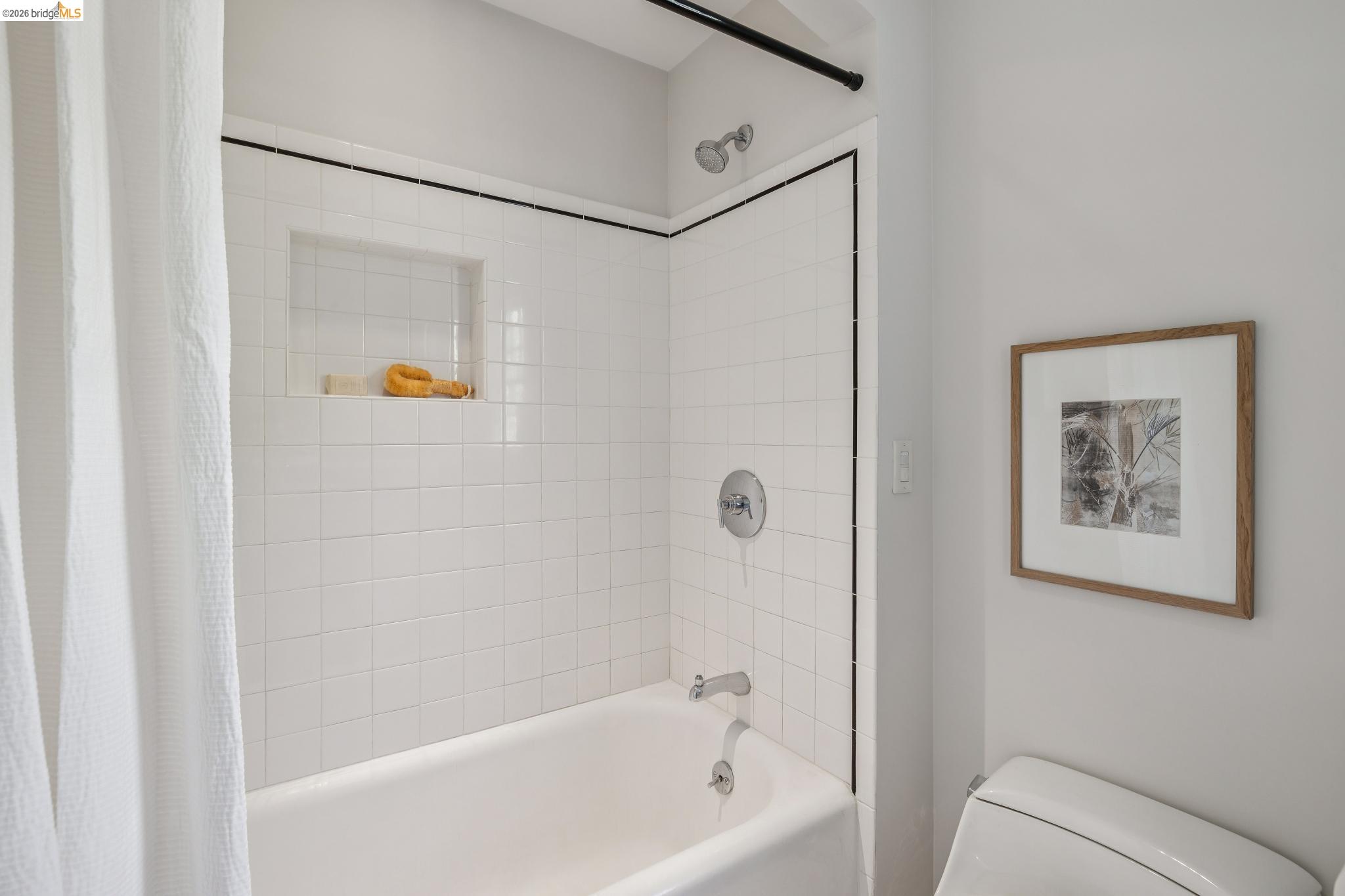 900 Rosemount Road Oakland, CA 94610 - Photo 47 of 59 a bathroom with a bathtub and a shower