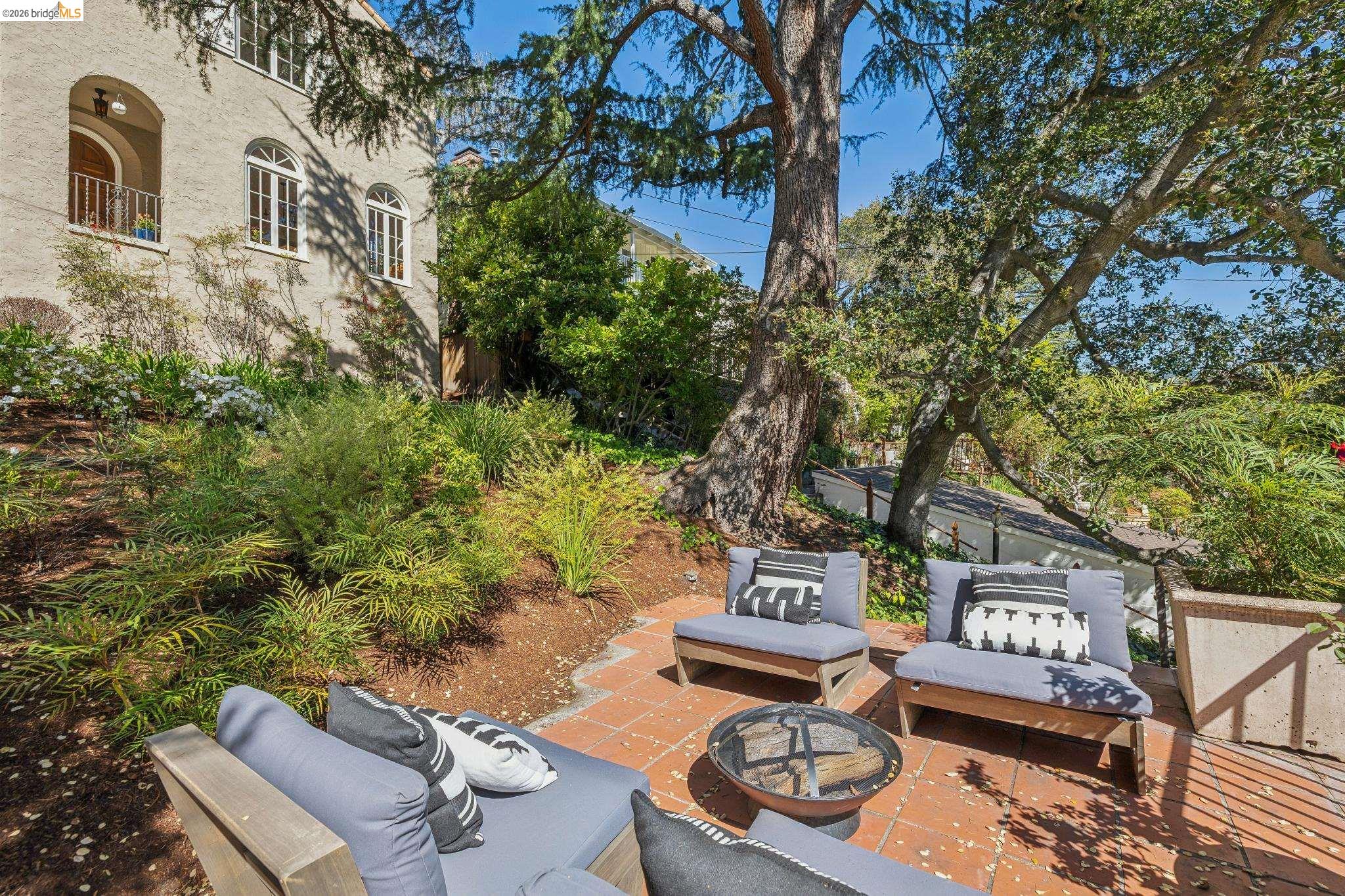 900 Rosemount Road Oakland, CA 94610 - Photo 5 of 59 a view of a chairs and table in a patio