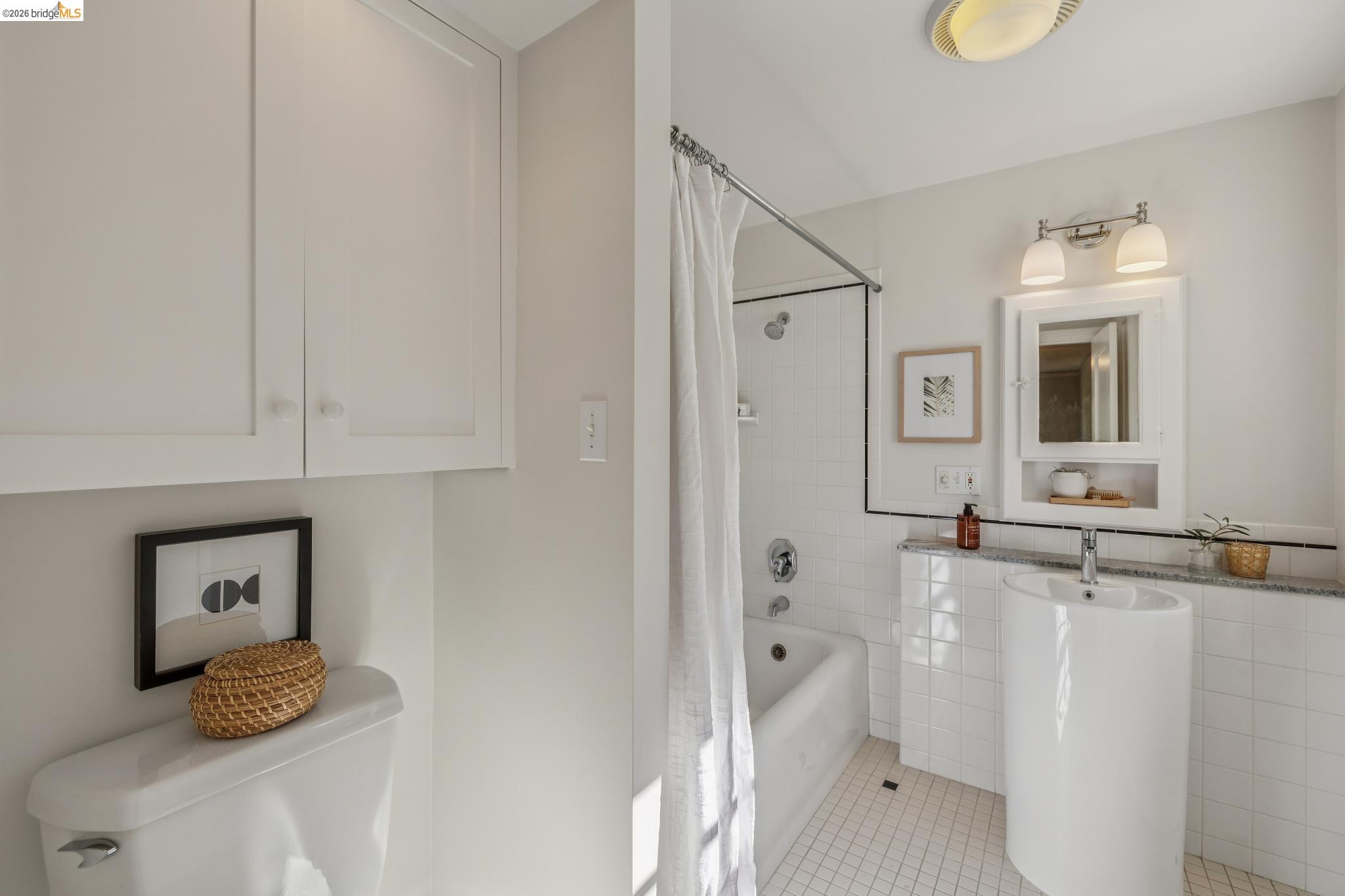 900 Rosemount Road Oakland, CA 94610 - Photo 54 of 59 a bathroom with a sink toilet and shower