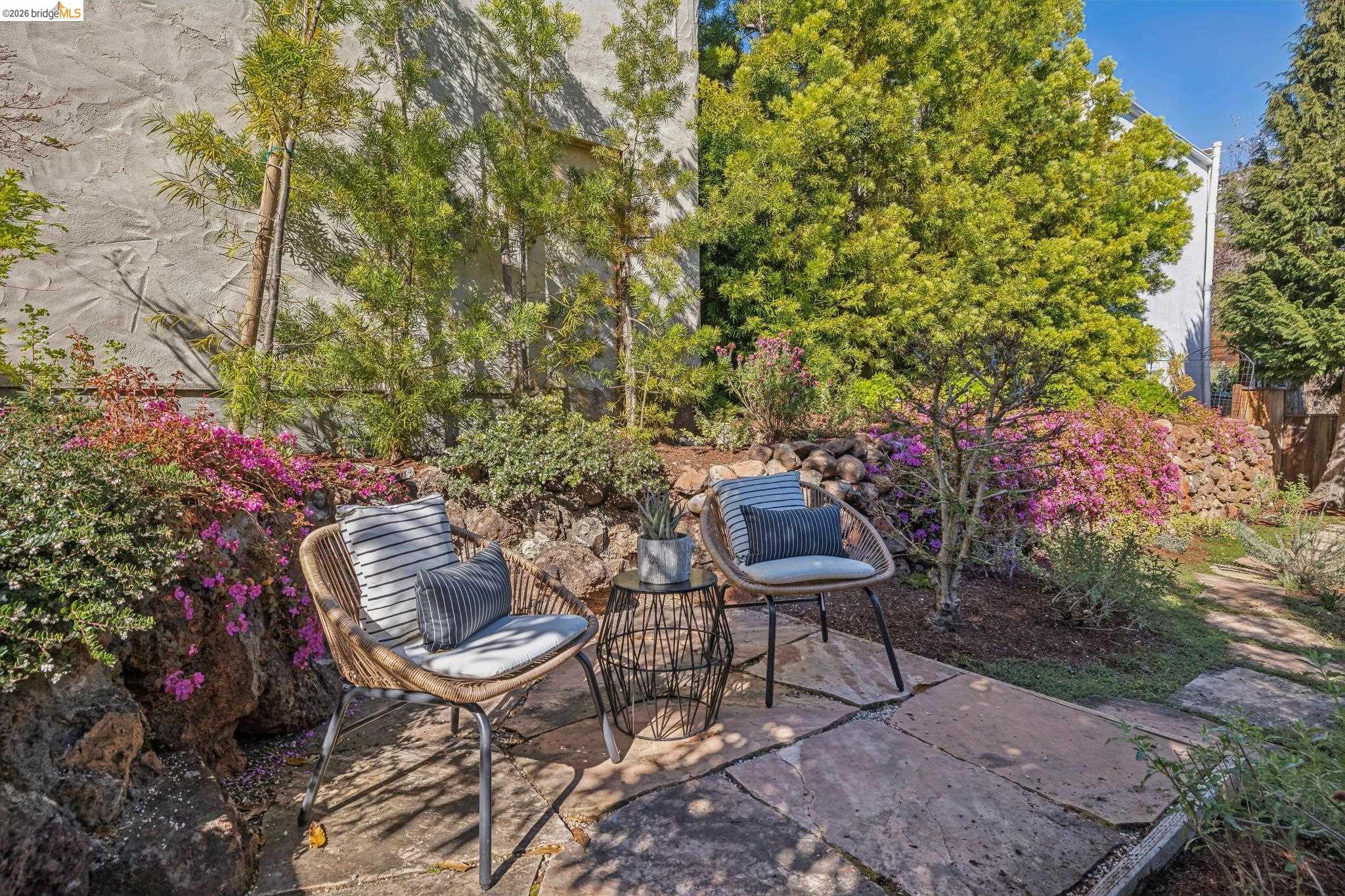 900 Rosemount Road Oakland, CA 94610 - Photo 57 of 59 a backyard with table and chairs and potted plants
