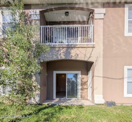 a view of front door of house with yard