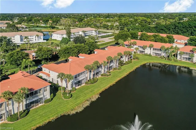 an aerial view of a house with a lake view