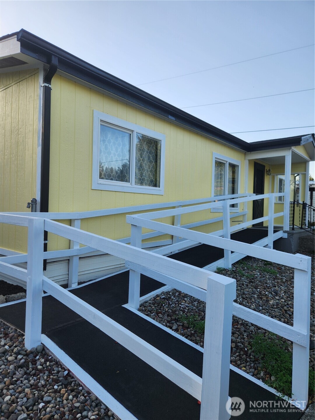 930 Trosper Road Southwest, Unit 130 Tumwater, WA 98512 - Photo 2 of 14 a living room with stainless steel appliances kitchen island granite countertop furniture and a rug