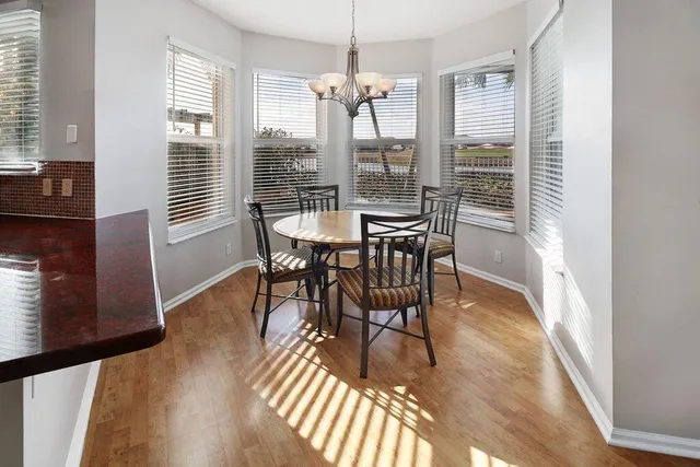 a view of bedroom and bedroom with wooden floor