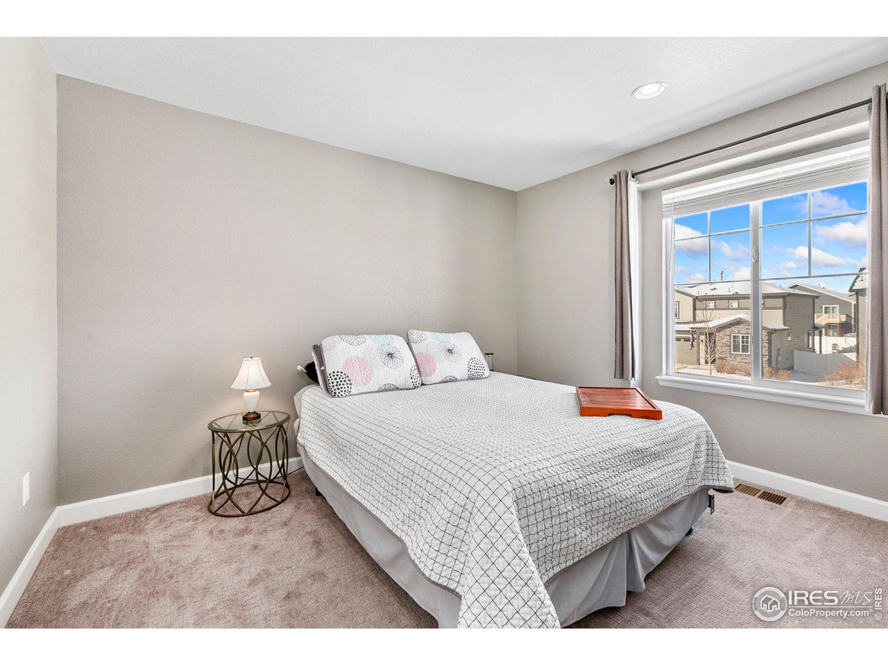 5231 Osbourne Drive Windsor, CO 80550 - Photo 16 of 20 a bedroom with a bed and window
