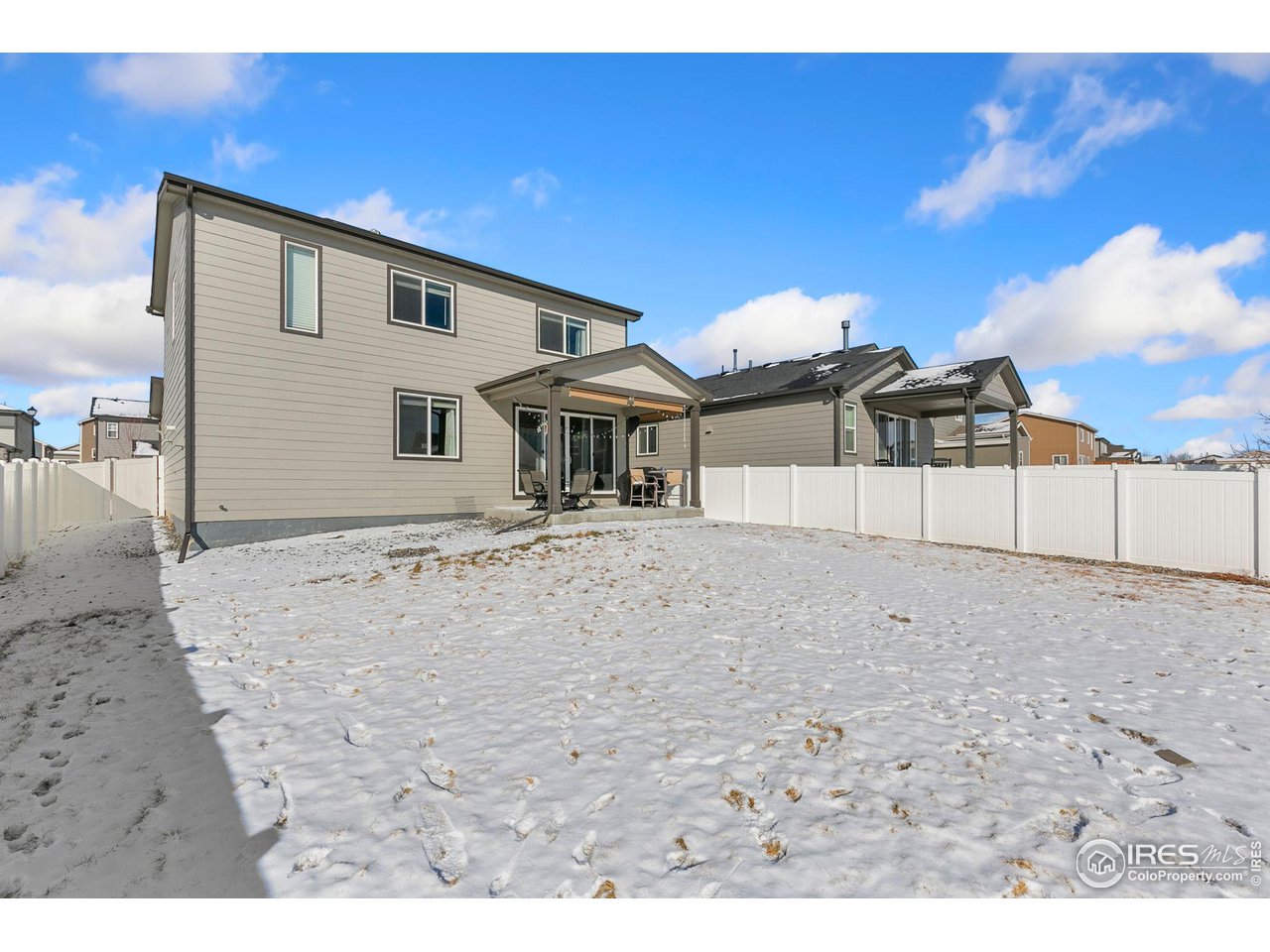 5231 Osbourne Drive Windsor, CO 80550 - Photo 19 of 20 a view of a house with a backyard