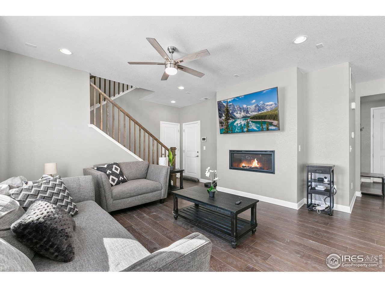5231 Osbourne Drive Windsor, CO 80550 - Photo 5 of 20 a living room with furniture and a fireplace