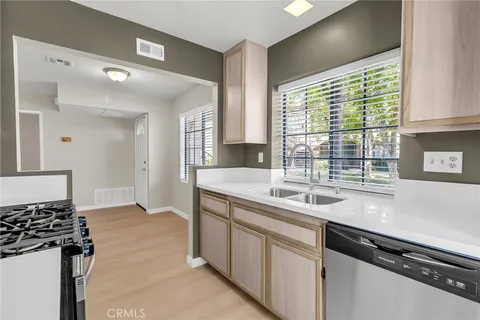 a kitchen with a sink and a stove