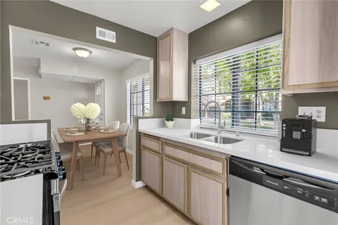 a kitchen with a sink and stove