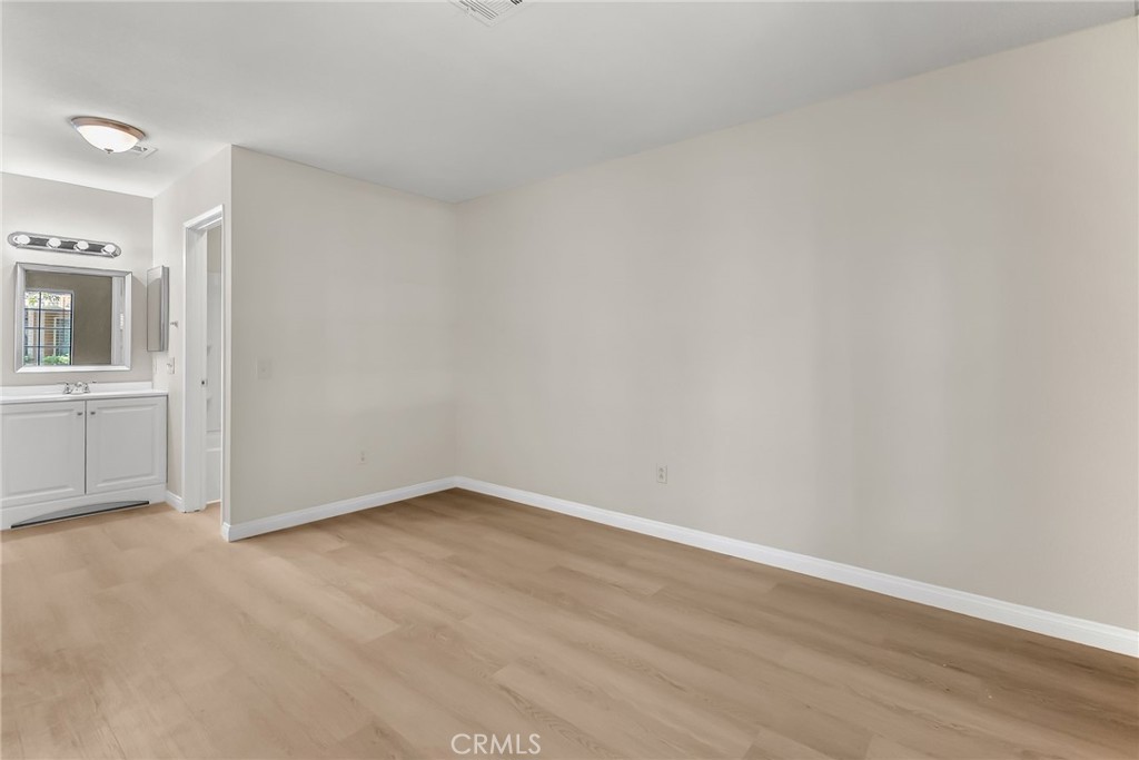 10668 Dabney Drive, Unit 125 San Diego, CA 92126 - Photo 18 of 27 a view of an empty room with a window