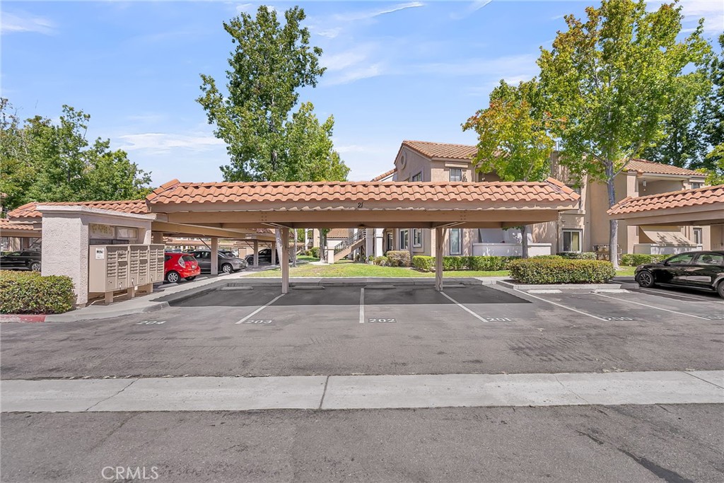 10668 Dabney Drive, Unit 125 San Diego, CA 92126 - Photo 26 of 27 front view of a building with a street