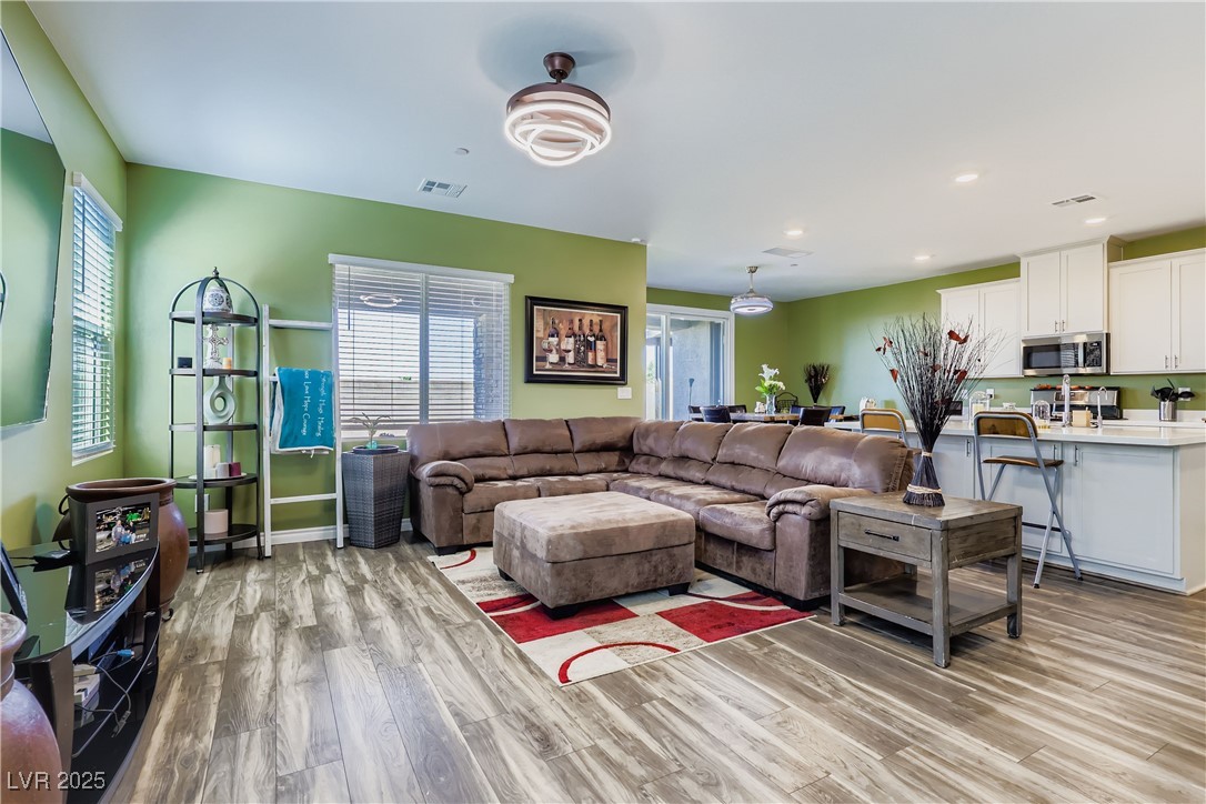 314 Robson Rdg Lane Henderson, NV 89015 - Photo 12 of 64 Living area featuring light wood finished floors, plenty of natural light, and recessed lighting