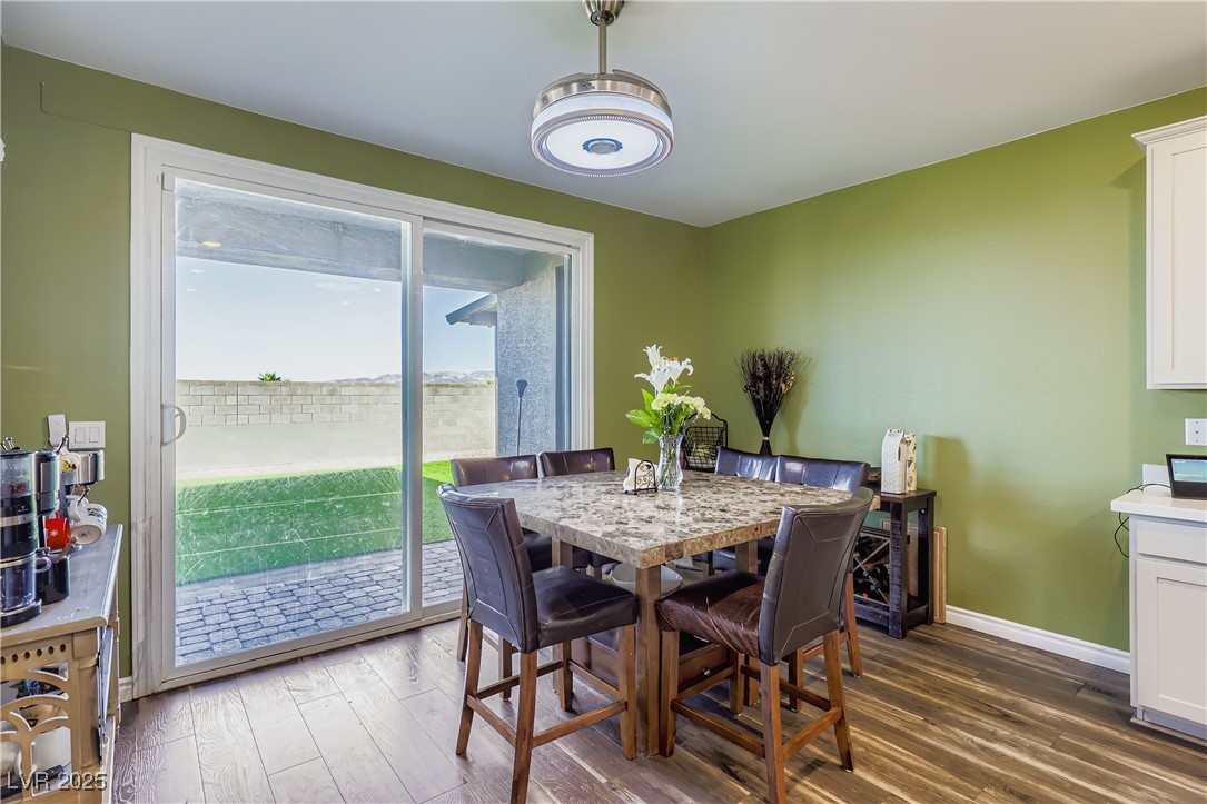 314 Robson Rdg Lane Henderson, NV 89015 - Photo 18 of 64 Dining room featuring dark wood-style flooring